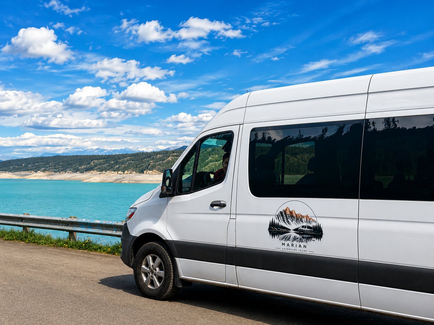 Sprinter side with logo by turquoise lake